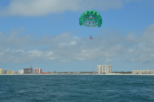 Parasailing with beach and condos in background