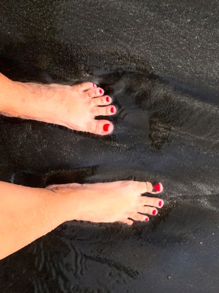 toes in black sand