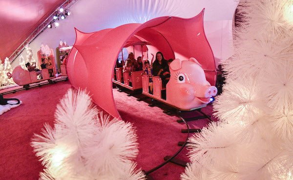 Patients from the Children’s Healthcare of Atlanta enjoy a ride on the Macy’s Pink Pig at Macy’s Lenox Square Mall in Atlanta, on Wednesday, Oct. 26, 2016. From its debut in the ‘50s as a children’s ride, five generations of Atlantans have ridden the Macy’s Pink Pig into the holiday season. (John Amis/AP Images for Macy's)